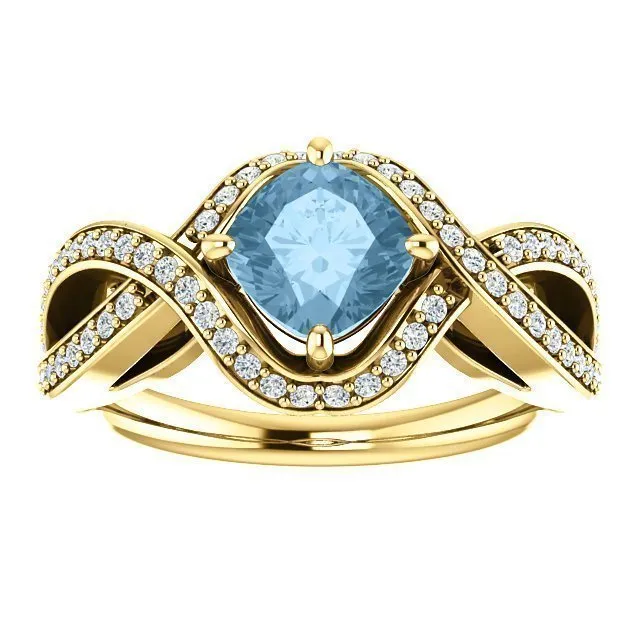 14KT GOLD 1.25 CT SKY BLUE TOPAZ & 1/3 CTW DIAMOND TWIST RING