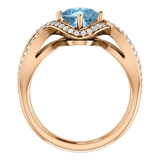 14KT GOLD 1.25 CT SKY BLUE TOPAZ & 1/3 CTW DIAMOND TWIST RING