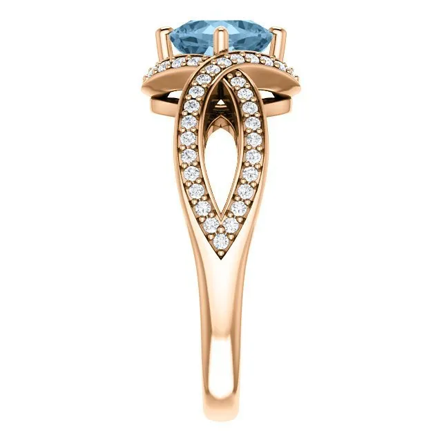 14KT GOLD 1.25 CT SKY BLUE TOPAZ & 1/3 CTW DIAMOND TWIST RING