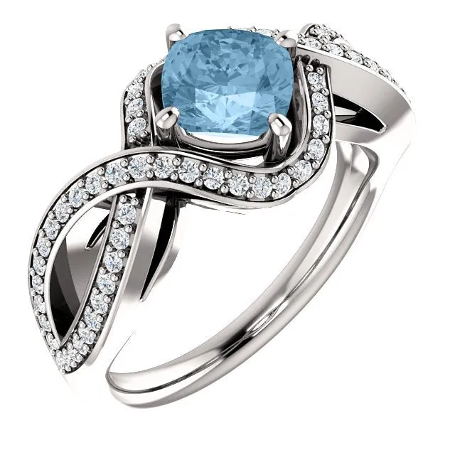 14KT GOLD 1.25 CT SKY BLUE TOPAZ & 1/3 CTW DIAMOND TWIST RING