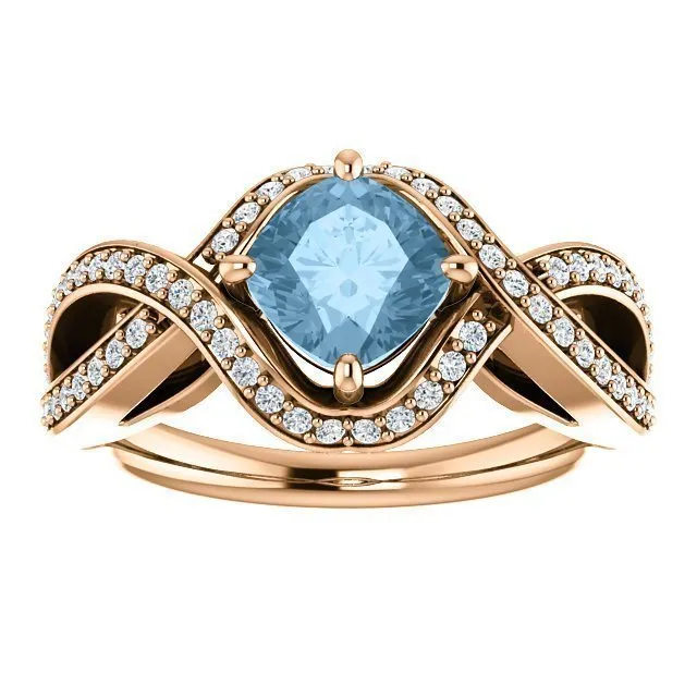 14KT GOLD 1.25 CT SKY BLUE TOPAZ & 1/3 CTW DIAMOND TWIST RING