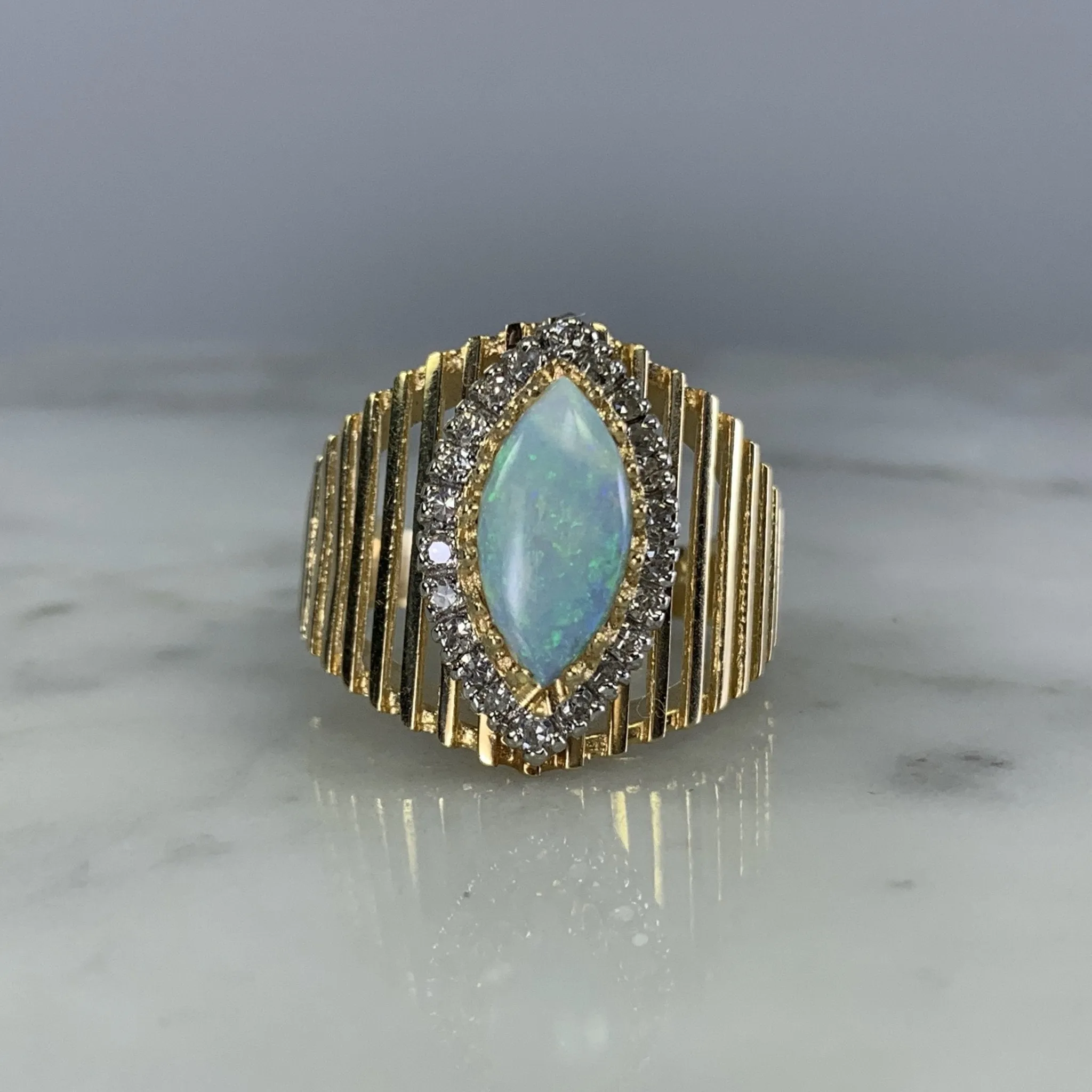 1970s Opal and Diamond Halo Statement Ring in a Large 14K Yellow Gold Setting.