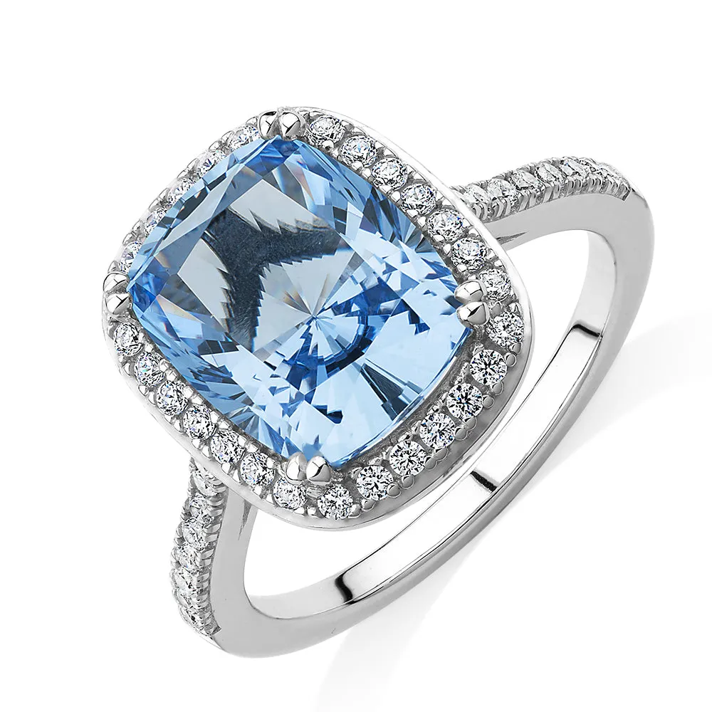 Dress ring with blue topaz simulant and 0.3 carats* of diamond simulants in sterling silver