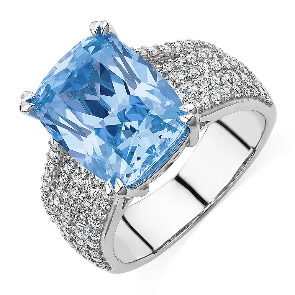 Dress ring with blue topaz simulant and 0.9 carats* of diamond simulants in sterling silver