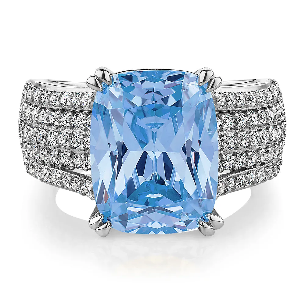 Dress ring with blue topaz simulant and 0.9 carats* of diamond simulants in sterling silver