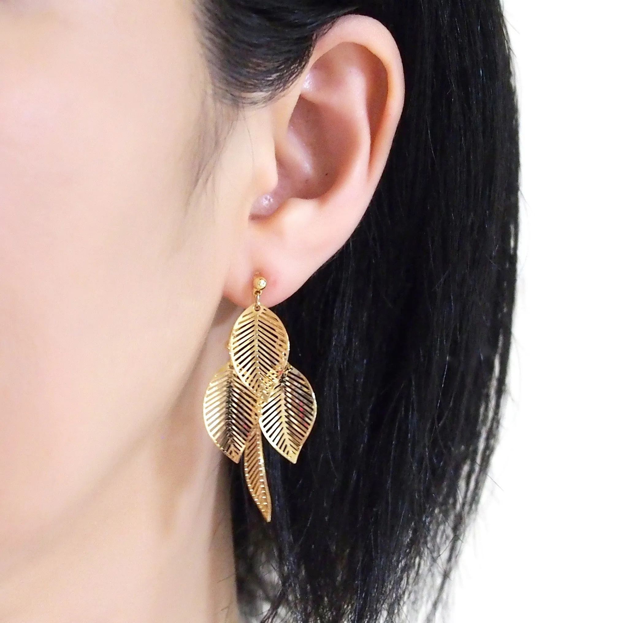 Gold four leaf filigree invisible clip on earrings