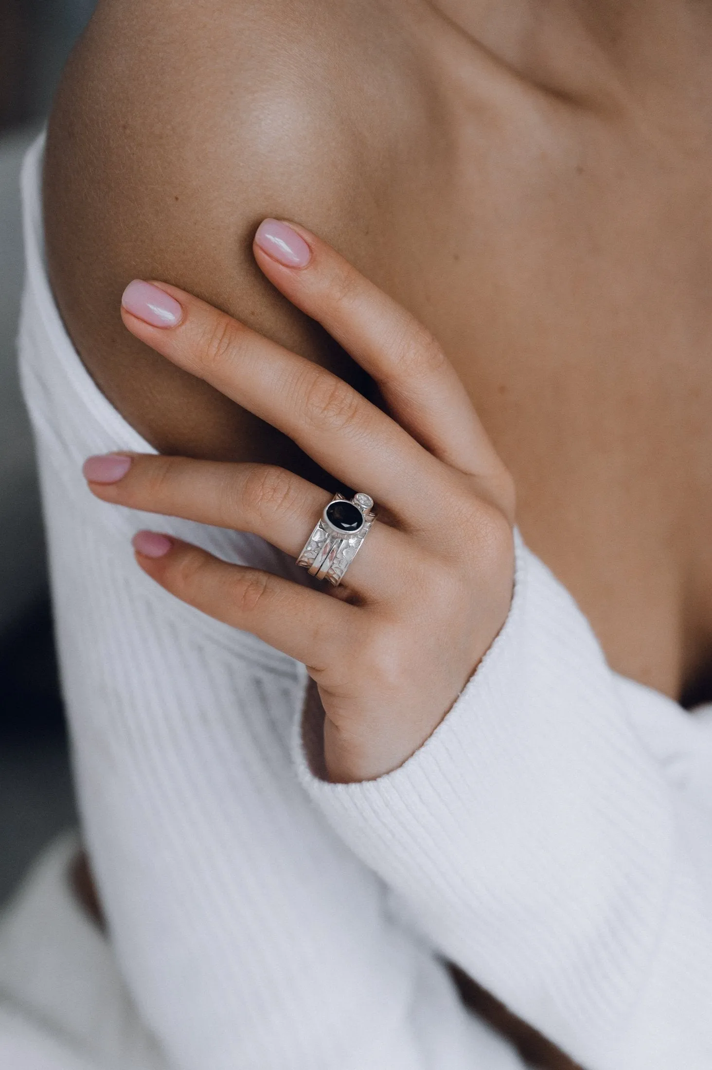 Mechanism Ring with Oval Facet Black Spinel and White Topaz