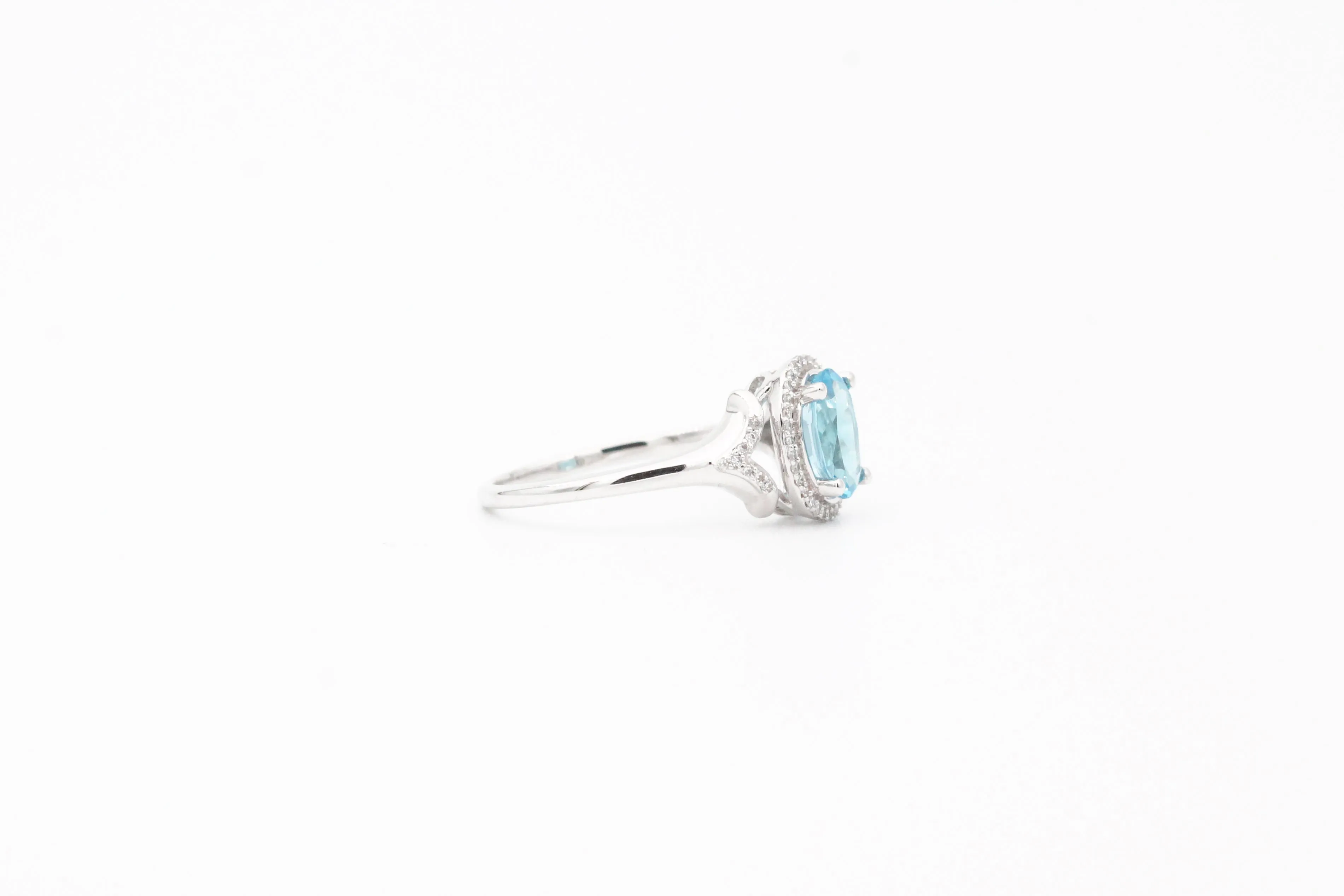 White Gold Oval Blue Topaz and Diamond Split Shank Halo Ring