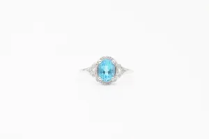 White Gold Oval Blue Topaz and Diamond Split Shank Halo Ring